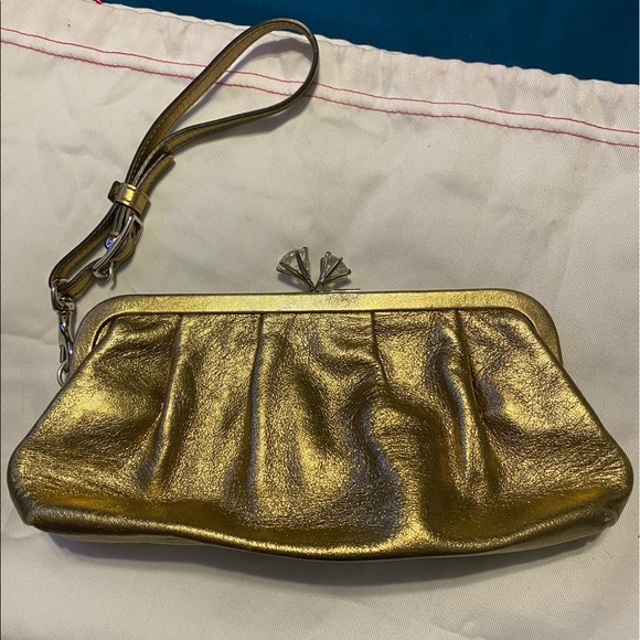 Coach Handbags - Coach gold wristlet/clutch